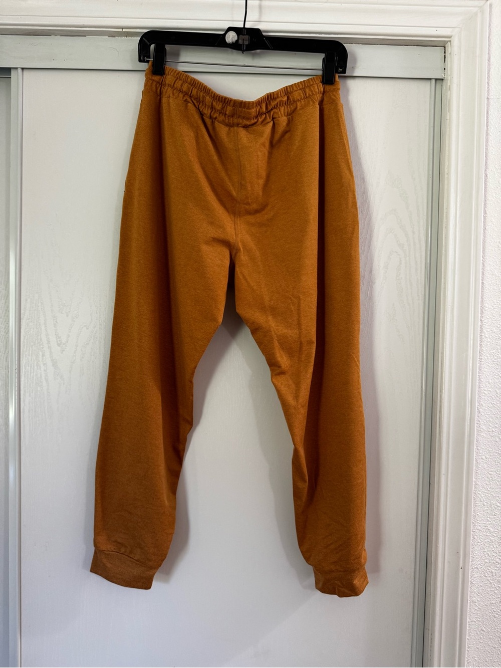 Vuori Women's Performance Joggers in a warm mustard yellow color - Picture 4 of 4